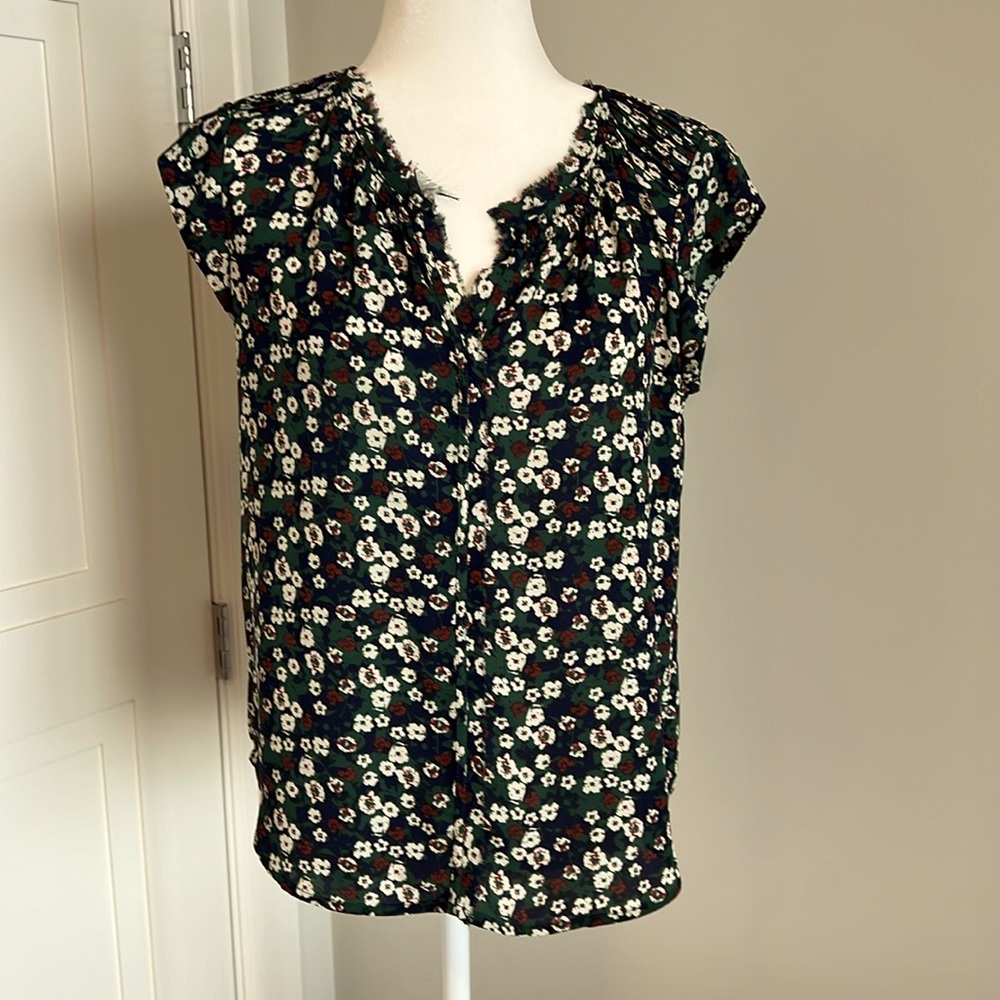 Floral, print sleeveless blouse, green, red and blue.